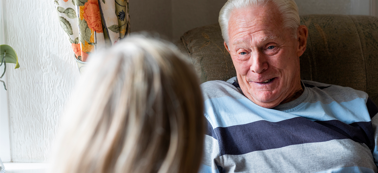 Elderly man in armchair